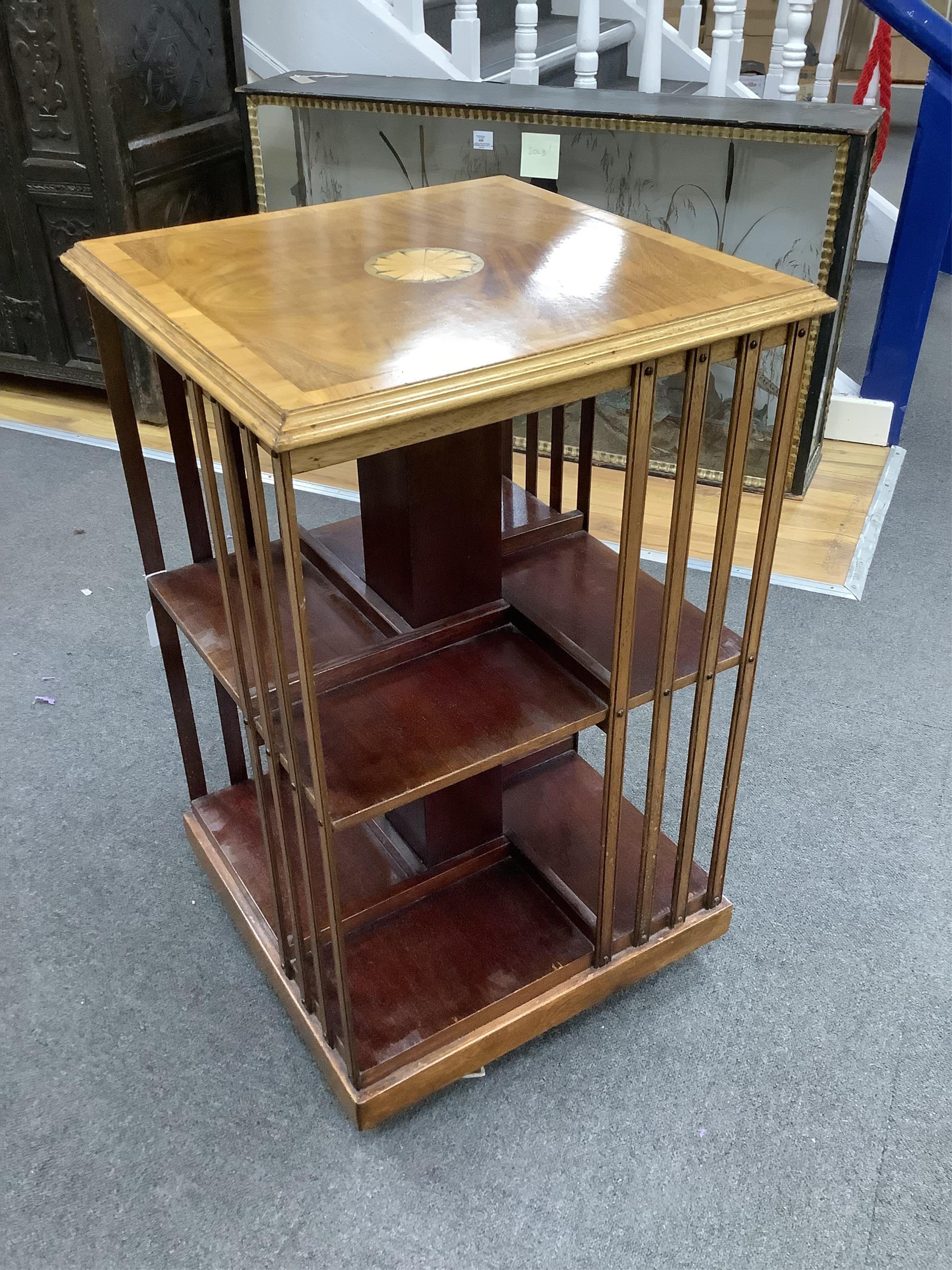 An Edwardian style paterae inlaid mahogany revolving bookcase, width 48cm, depth 48cm, height 81cm. Condition - good